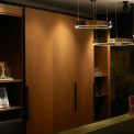 Photo asymmetrical travertine pendant light walk-in closet
