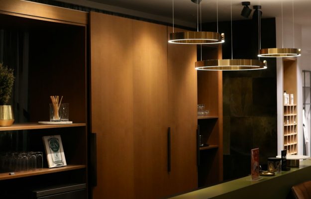 Photo asymmetrical travertine pendant light walk-in closet